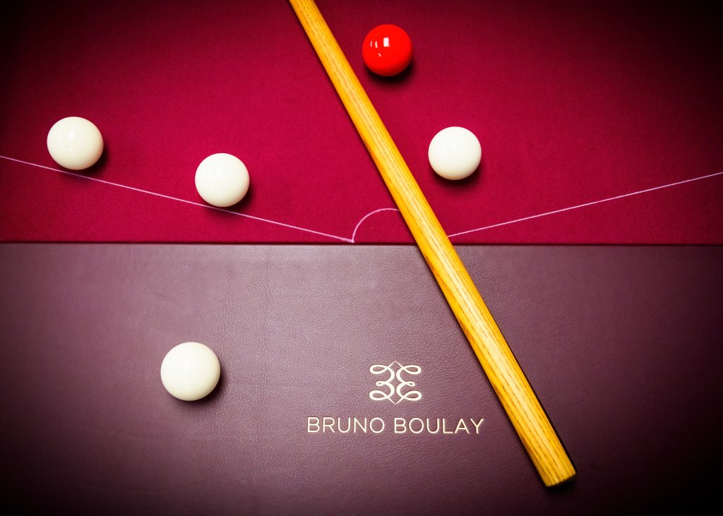 Hand-fitted leather cushion and pocket on a handmade bar billiards table