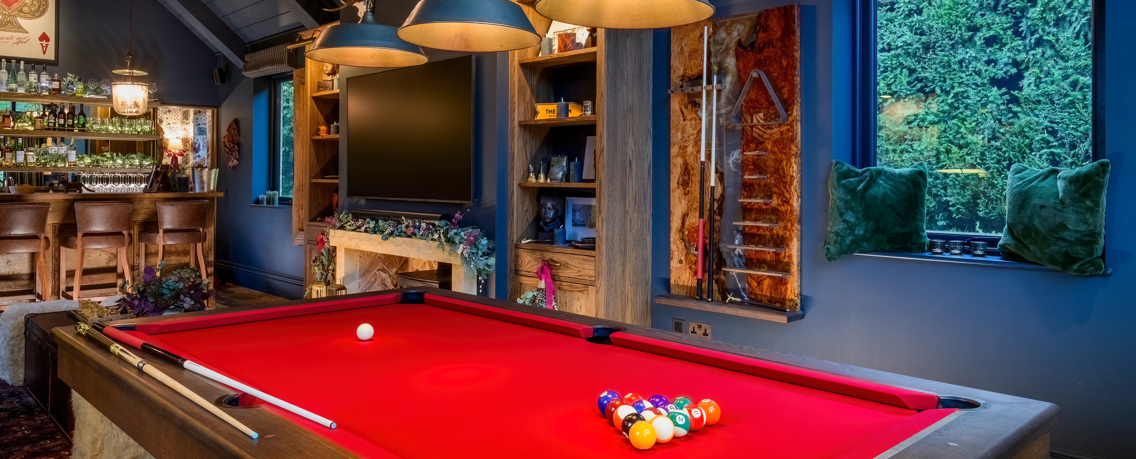 Handcrafted walnut luxury pool table in a converted country barn