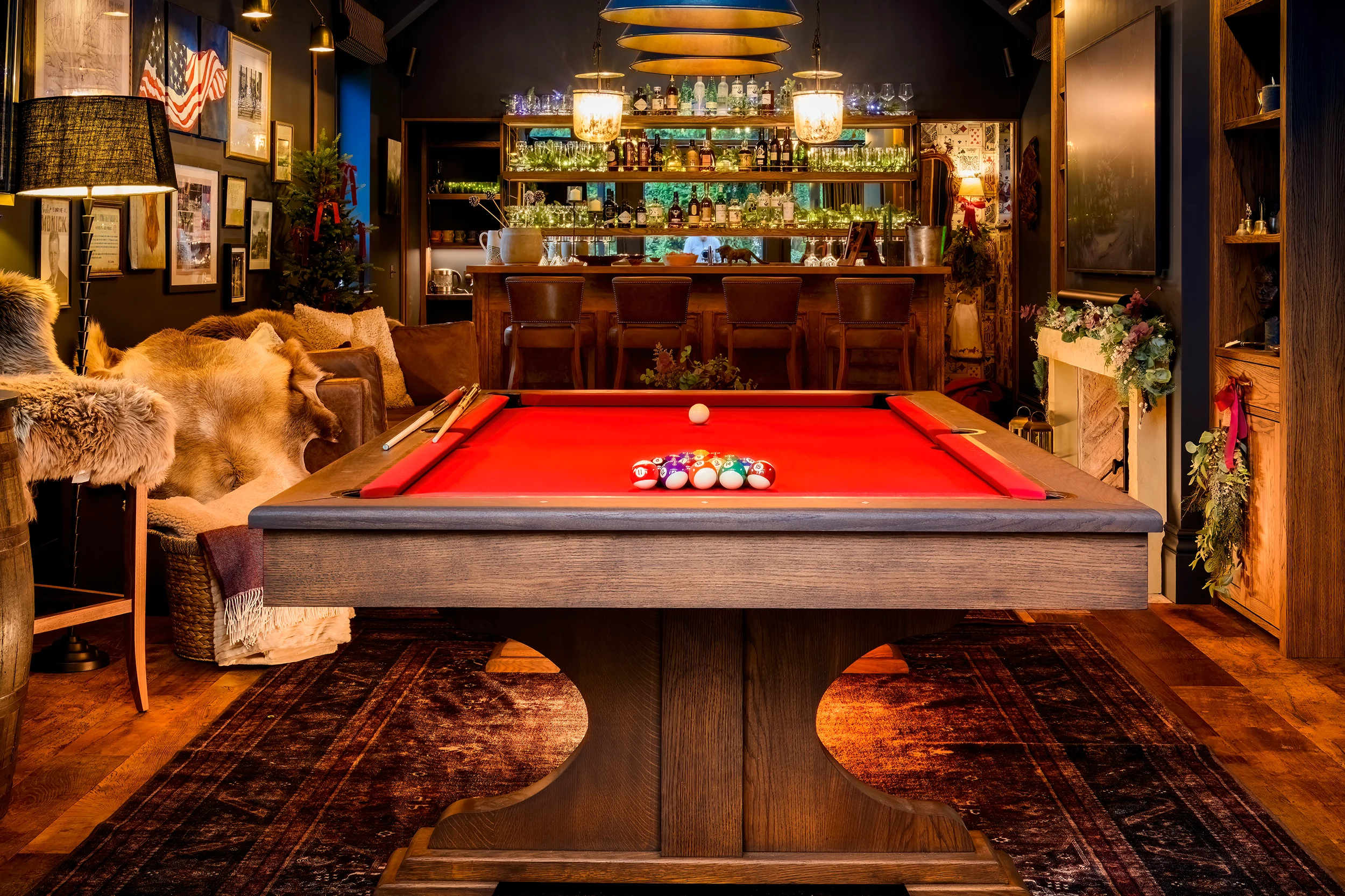 Luxury pool table with red felt in a sophisticated games room
