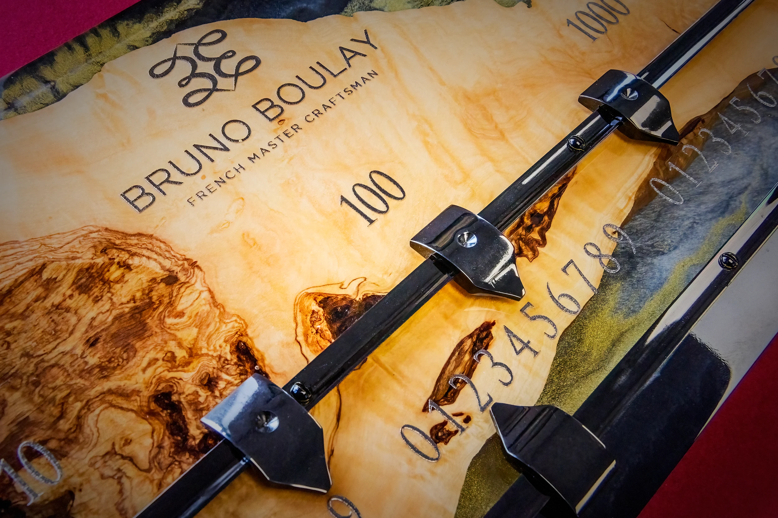 Hand-etched burl wood scoreboard panel bearing the Bruno Boulay mark