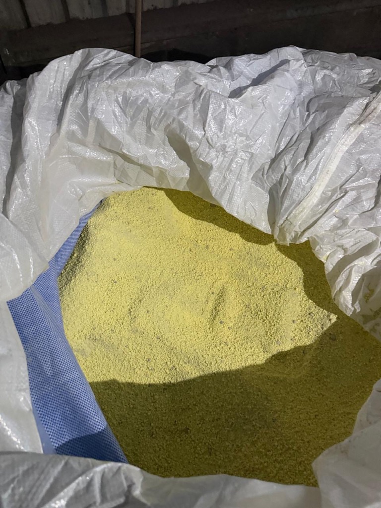 An industrial bulk bag filled with yellow sulfur prills