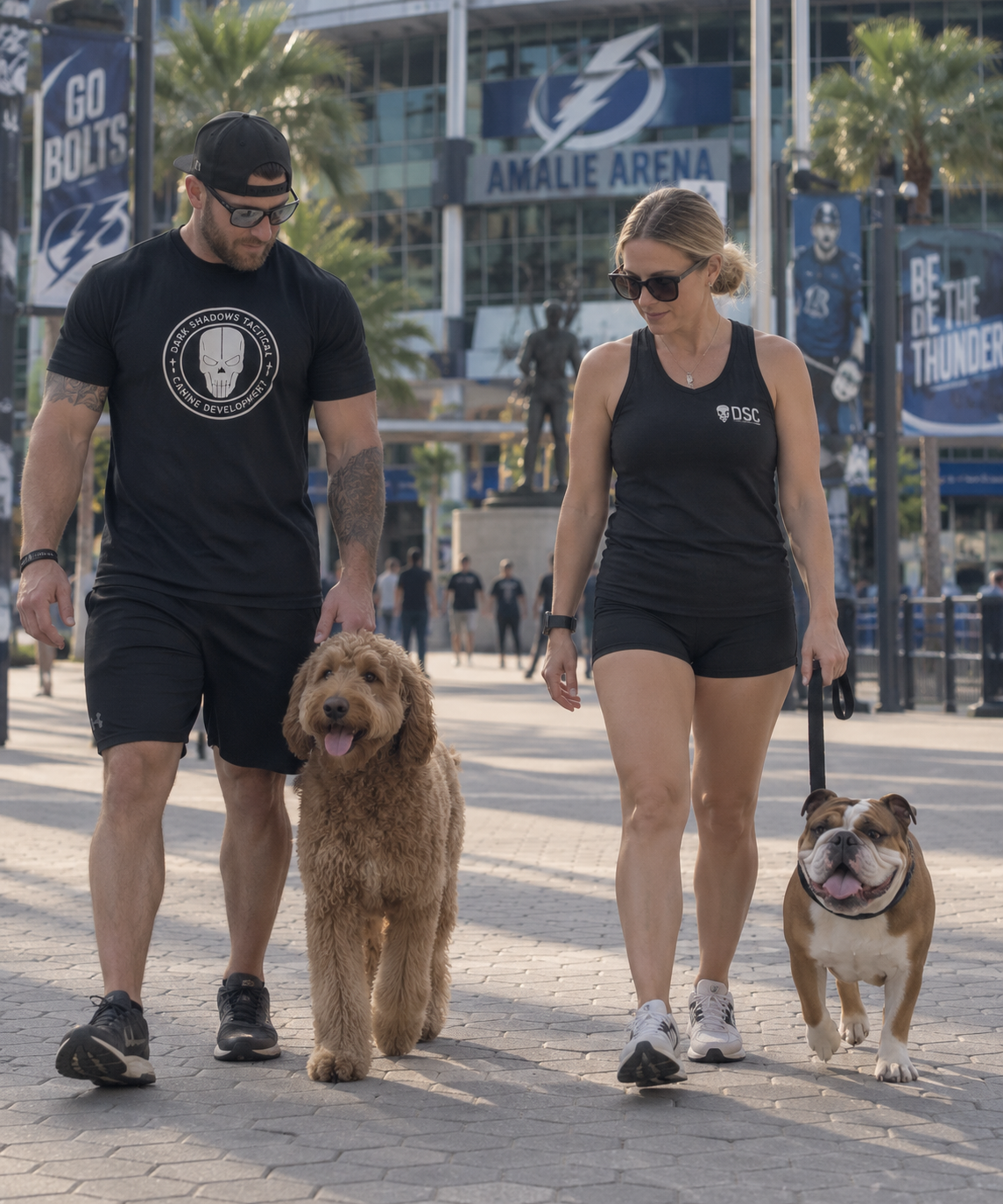 DSC team walking dogs in front of Amalie Arena