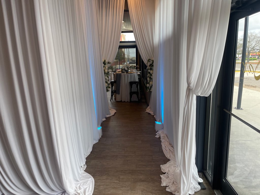 Draped entryway opening into the reception hall