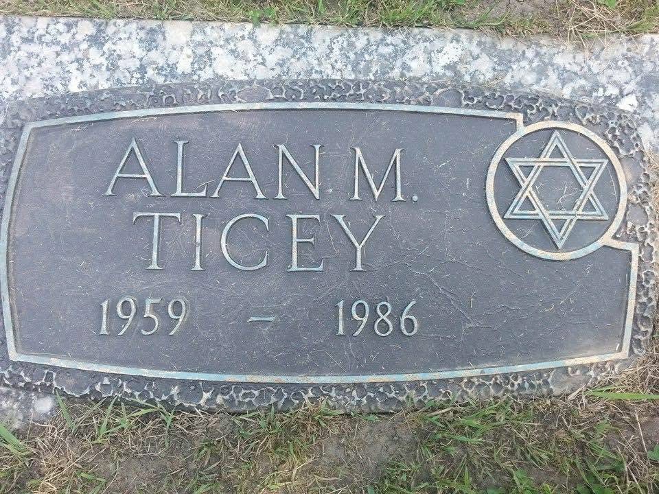 The memorial headstone of Alan M. Ticey (1959–1986), Alan Austin's father — a quiet place of memory and remembrance