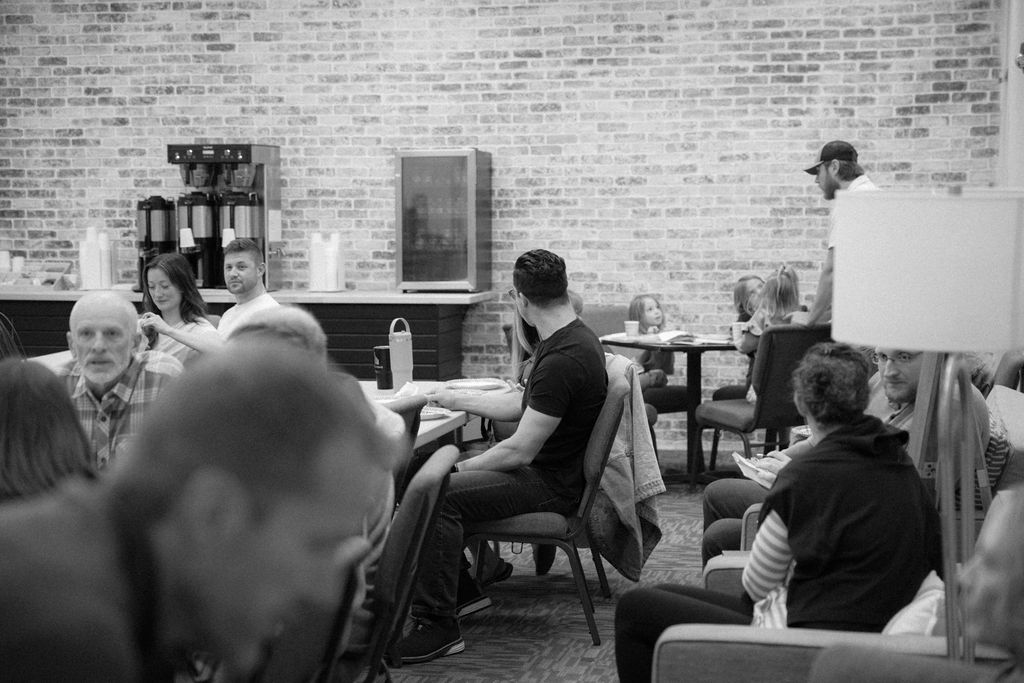 Church community gathered in discussion and prayer
