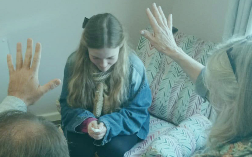 Two people in an intimate prayer ministry session