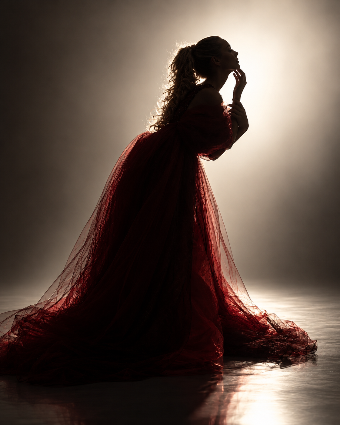 A silhouette in red tulle, backlit