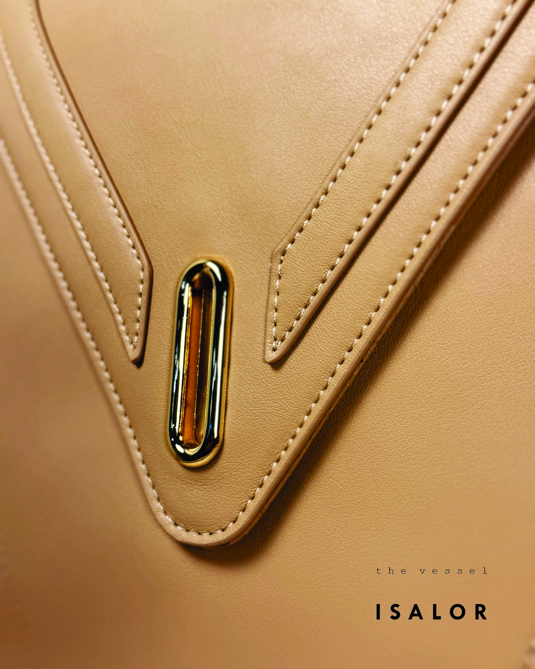 The Vessel gold hardware and V stitching detail by ISALOR
