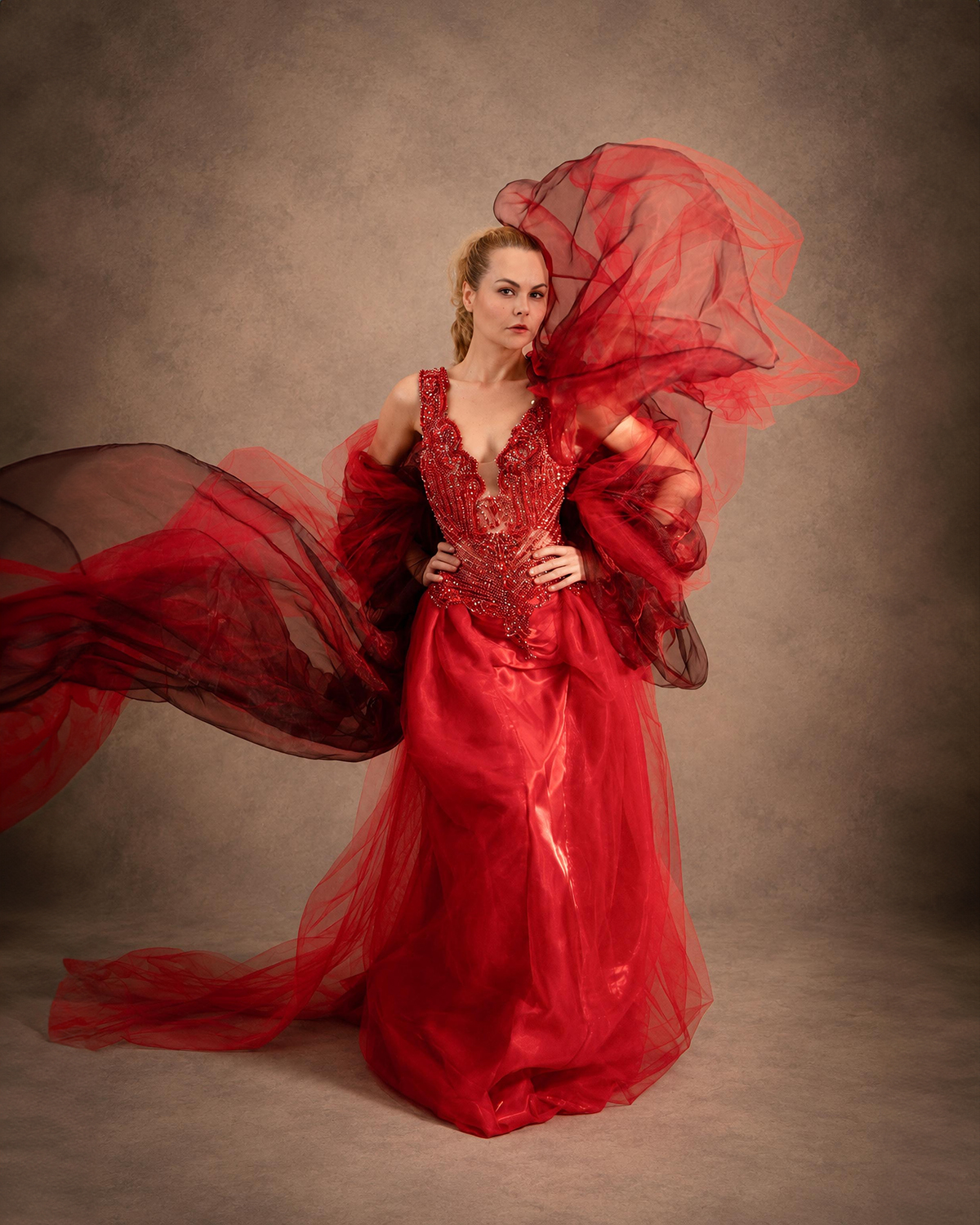 Marpacífico — crimson and bordeaux organza caught in movement