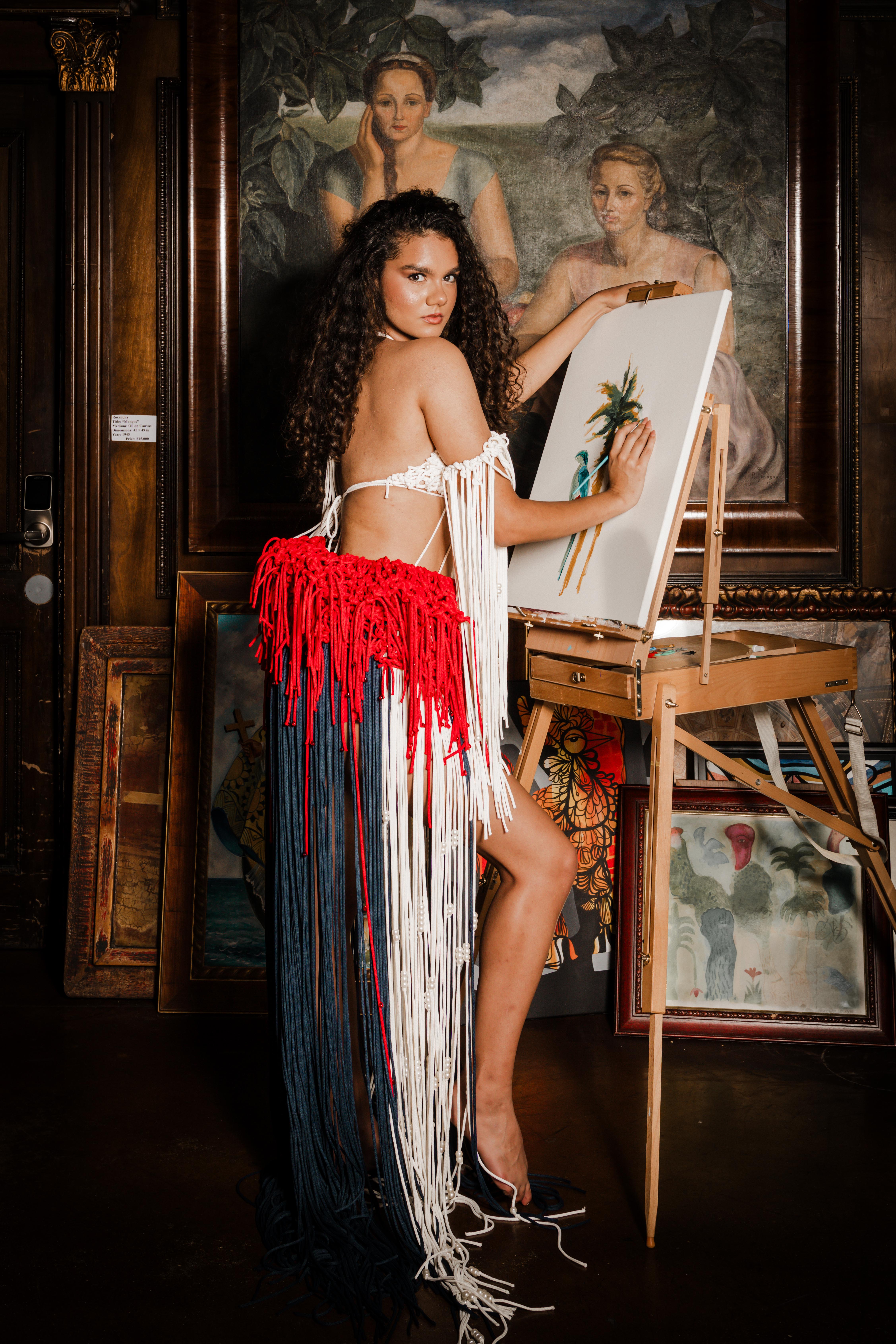 The model before an easel, wearing the ISALOR Untitled Textile Composition