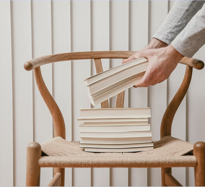 Stack of books on a wooden chair
