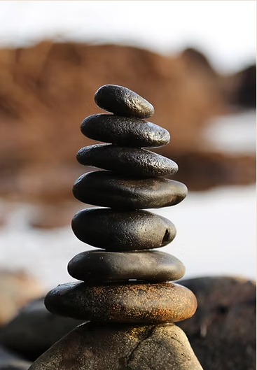 Stack of balanced dark river stones
