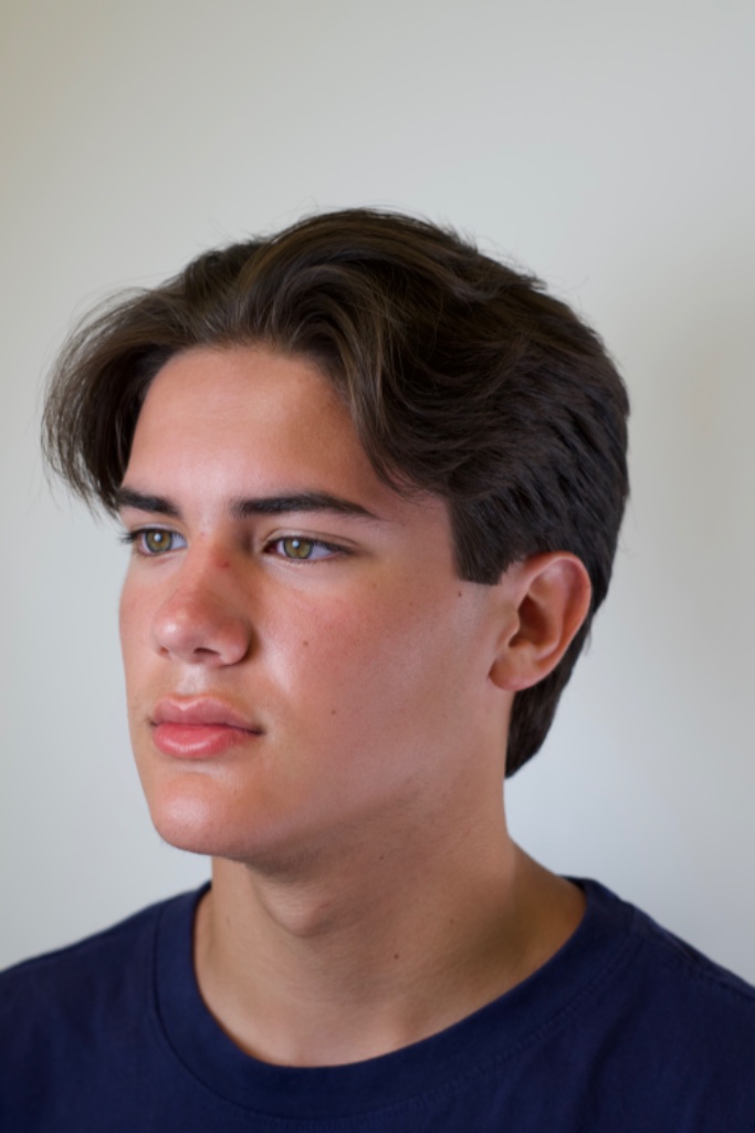 Three-quarter portrait of wavy medium-length dark hair with volume on top