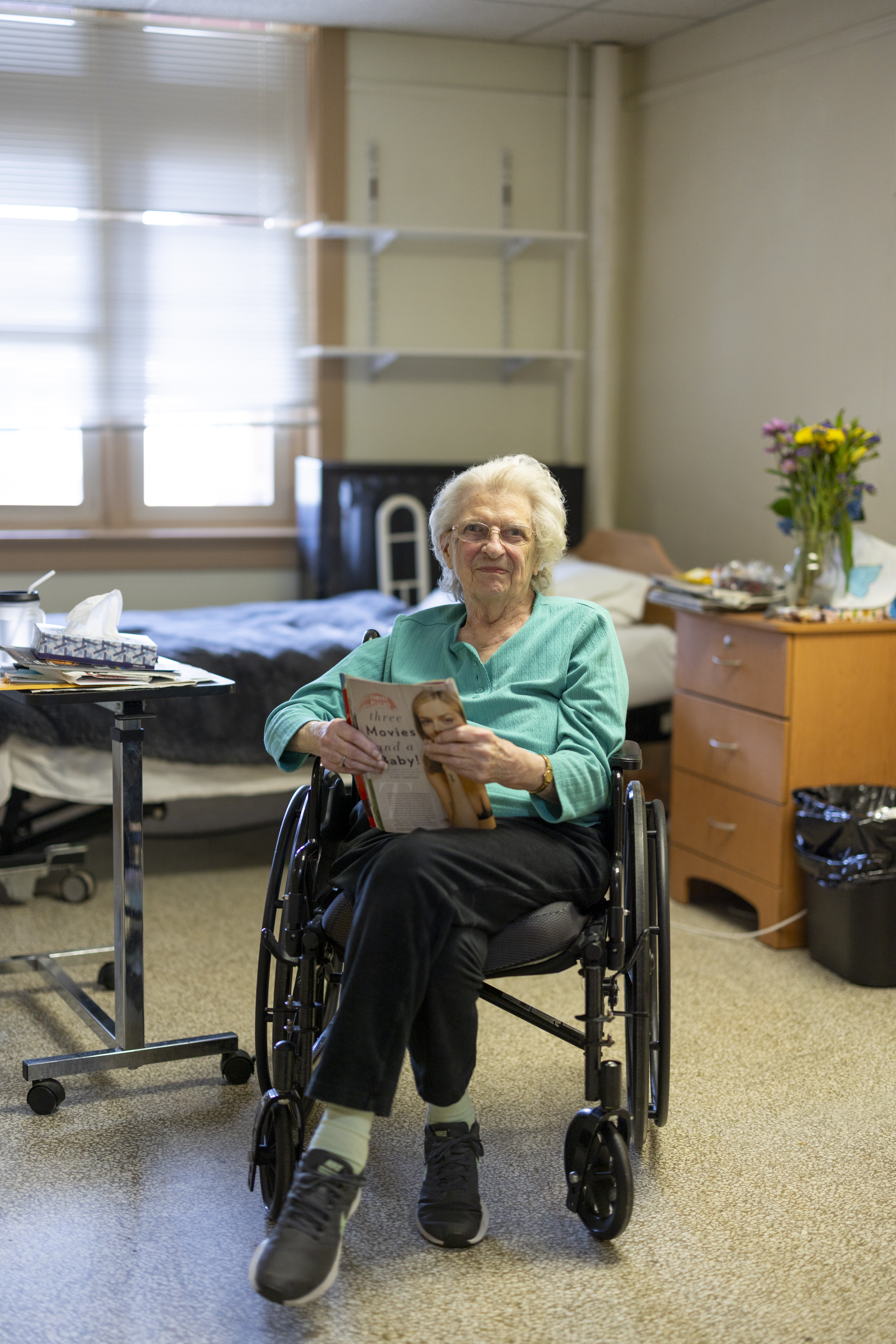 A resident in her room — care delivered with dignity and personal attention.