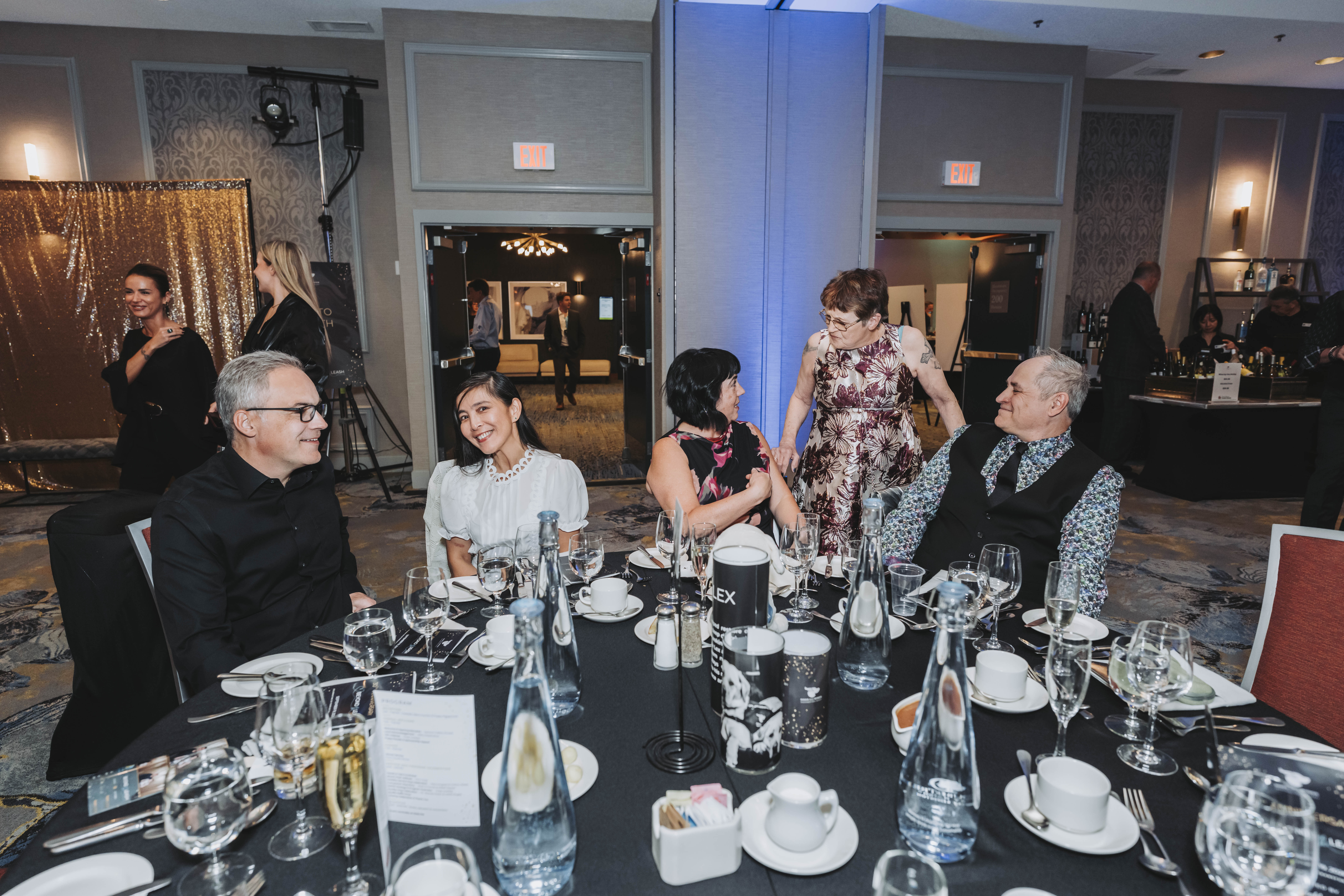 Guests seated at a gala dinner table