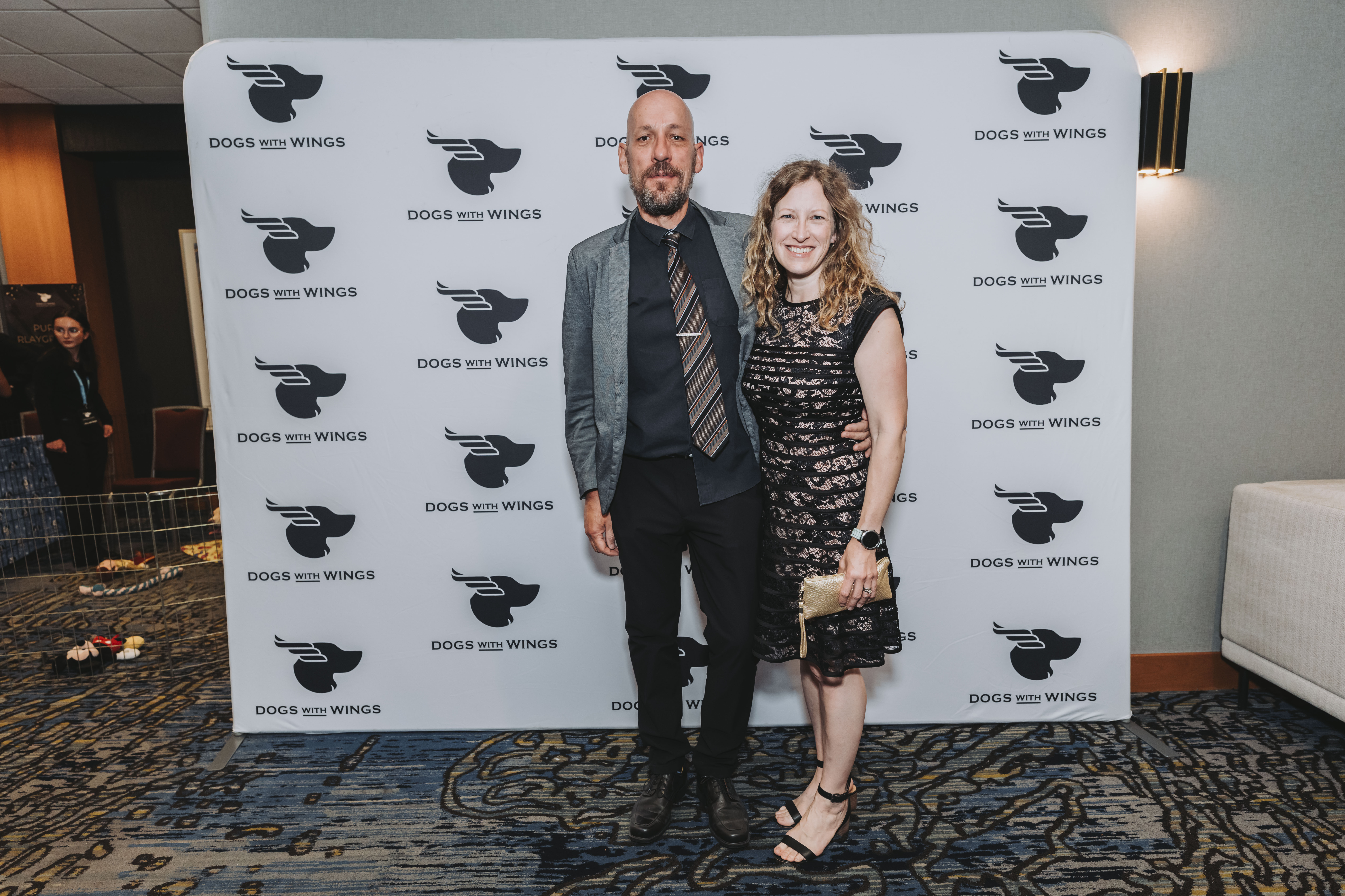 Two guests dressed for the evening at the photo wall