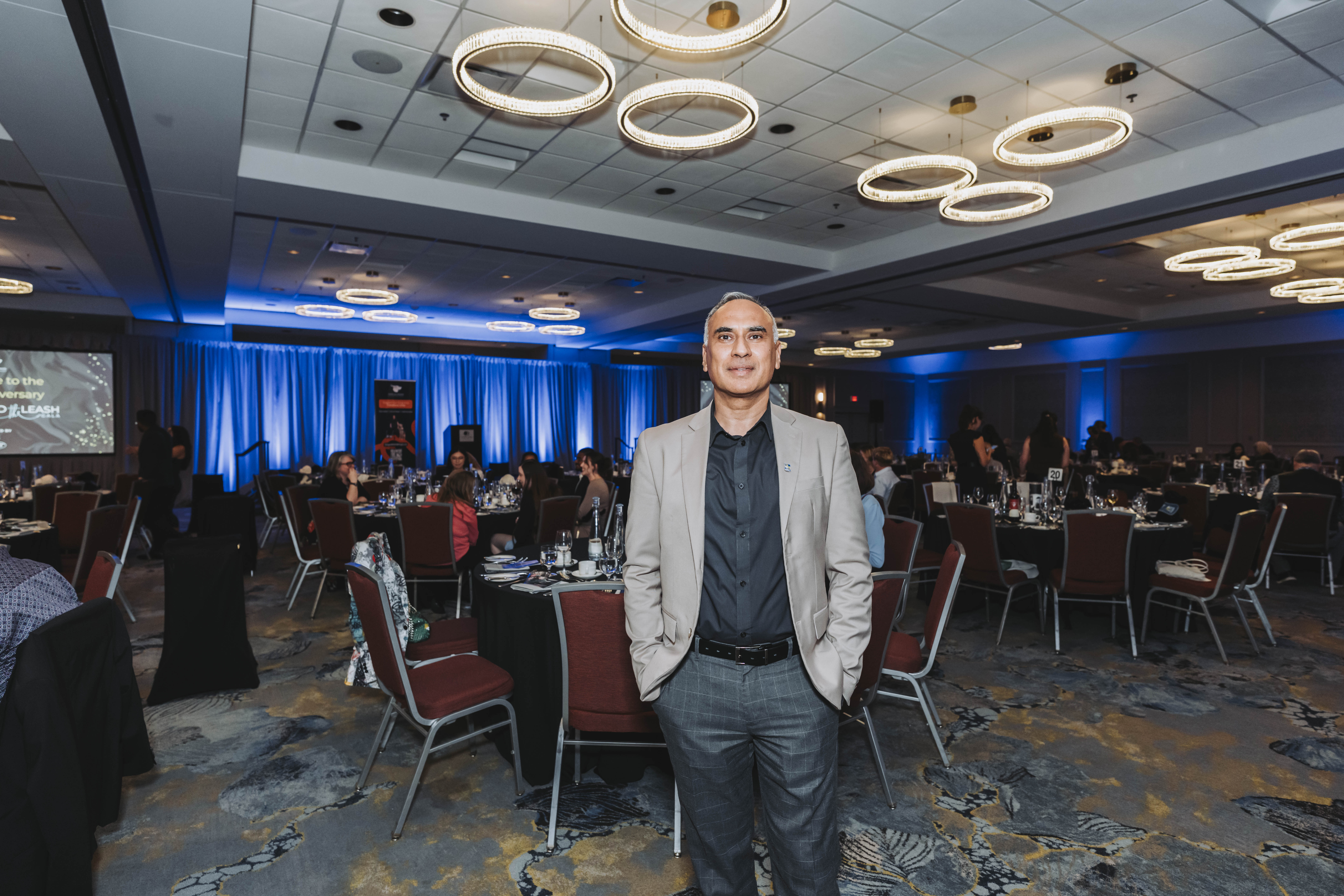 A guest standing in the ballroom before the gala dinner