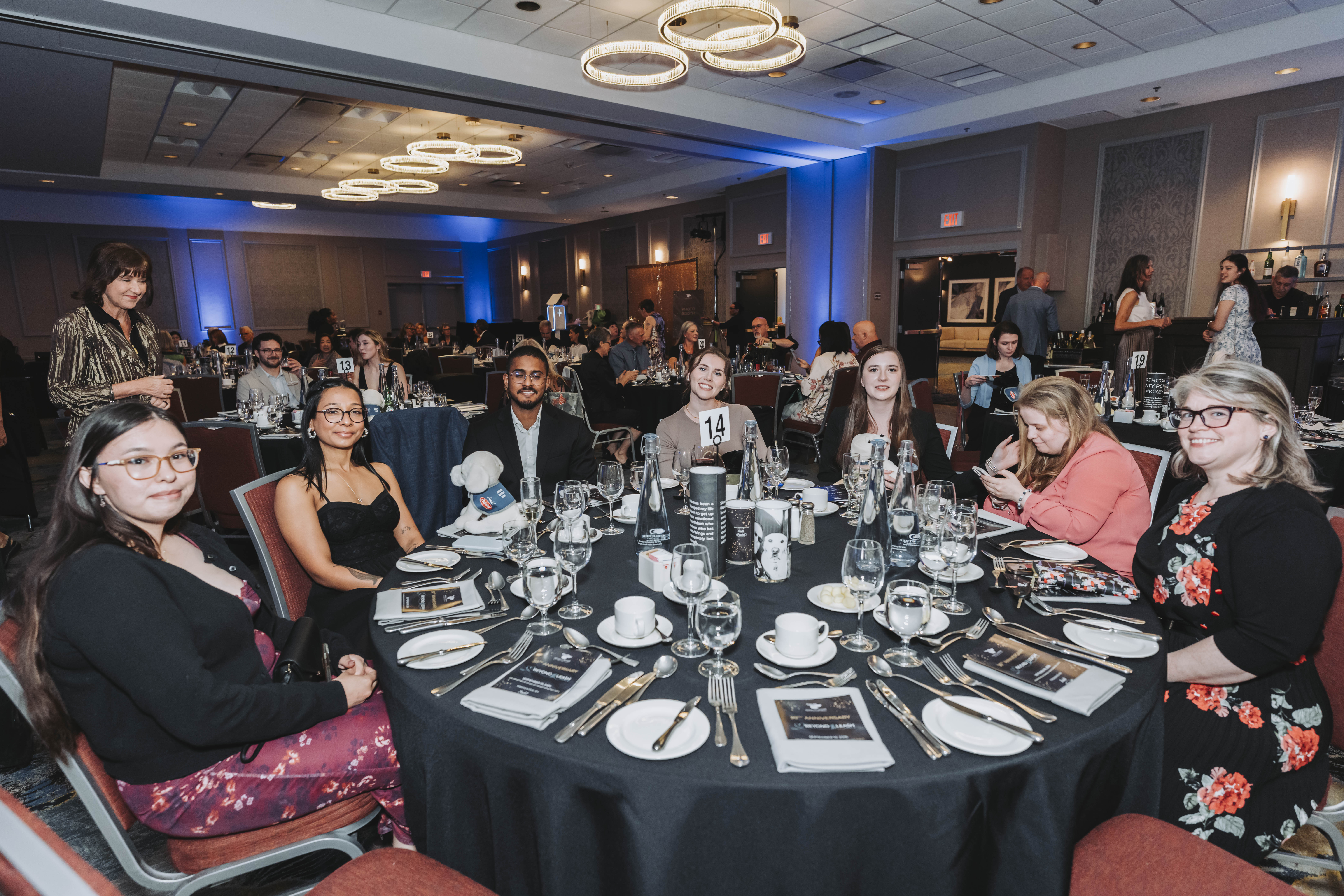 Guests seated around table fourteen at the gala dinner