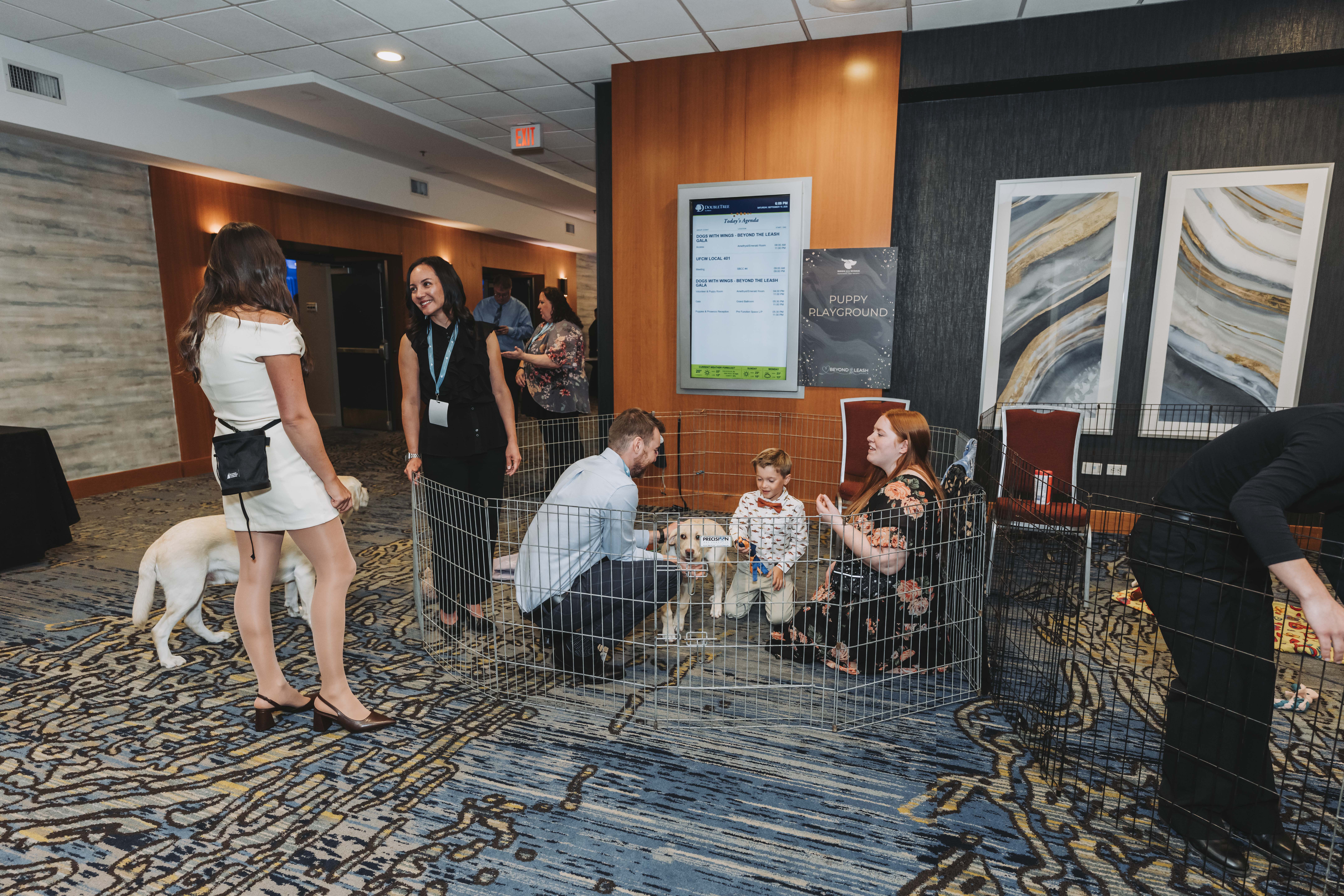 Guests visiting the puppy playground during the gala