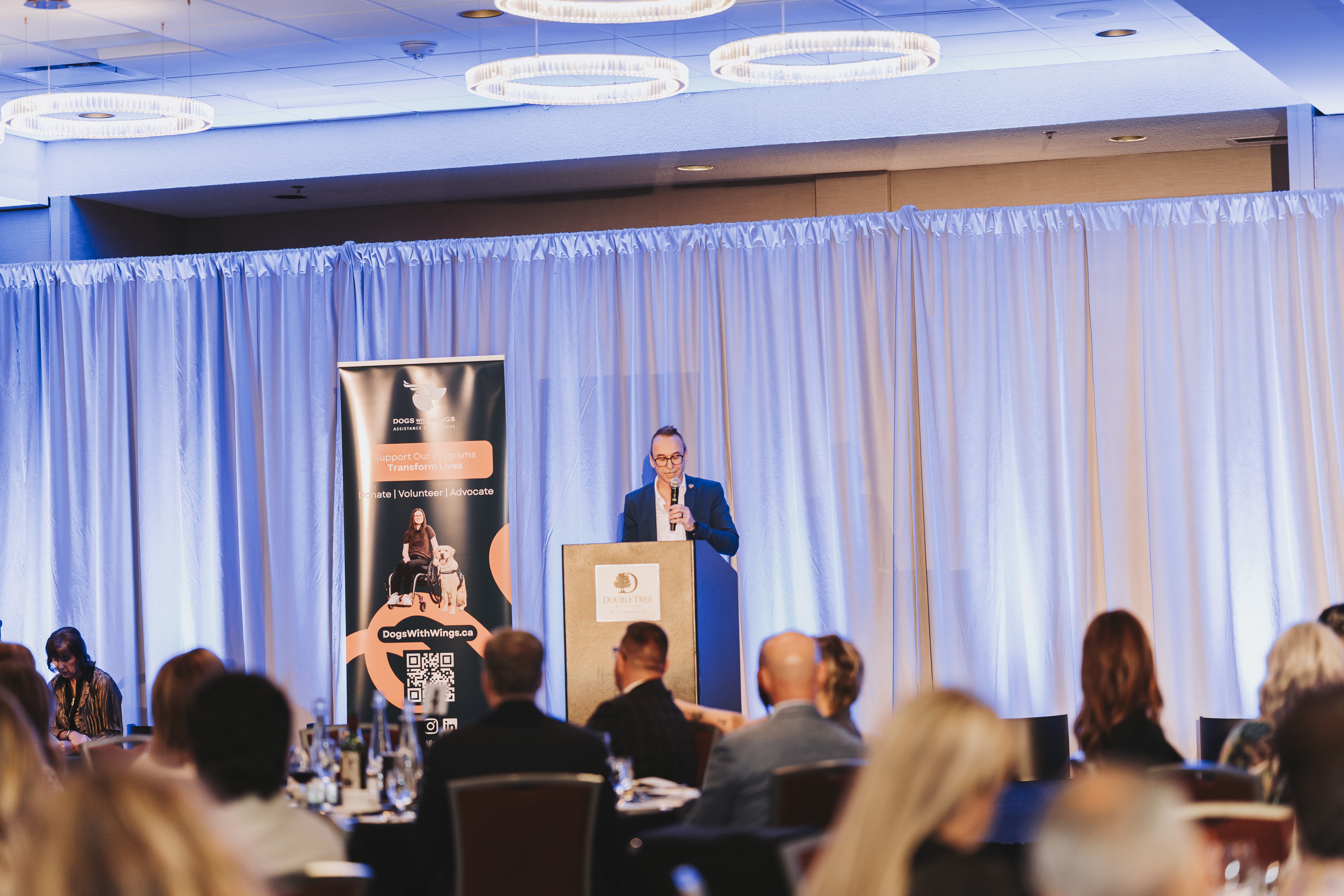 A guest speaking at the podium during the gala program