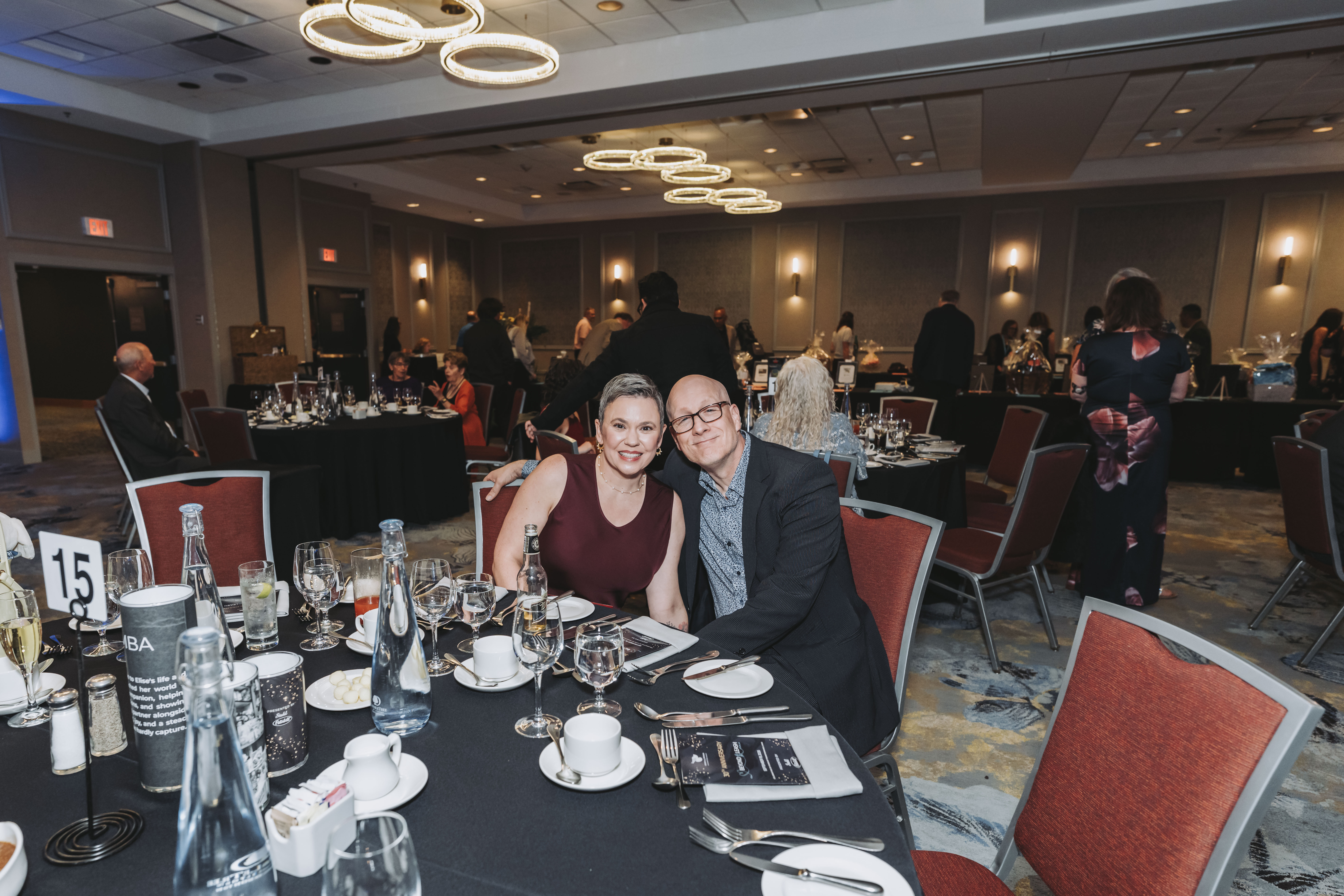 A couple smiling together at table fifteen