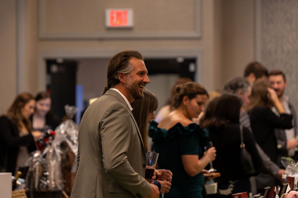 Gala 2025 man laughing at silent auction