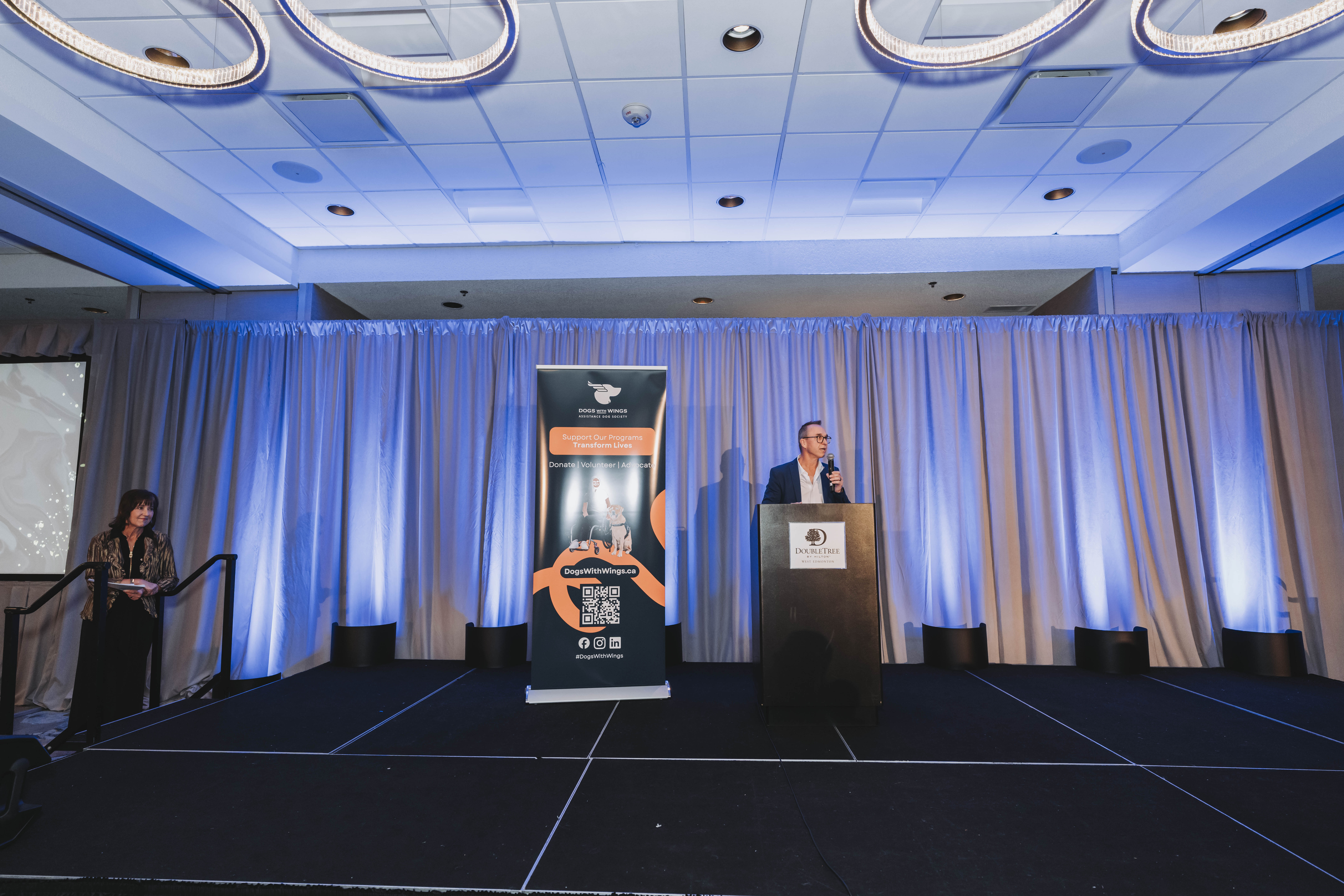 A guest speaking from the lectern on the gala stage