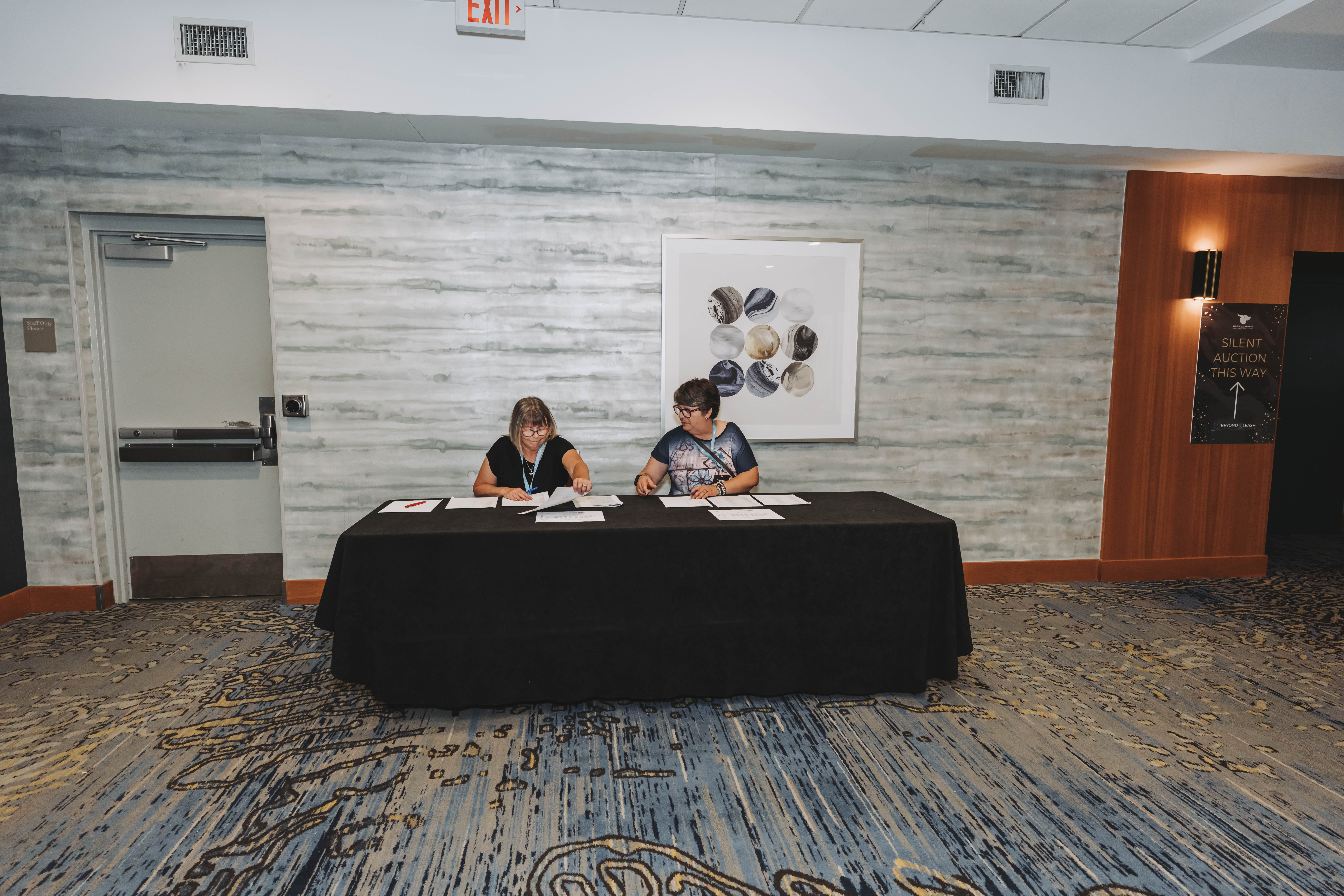 Volunteers at the gala registration table during check-in