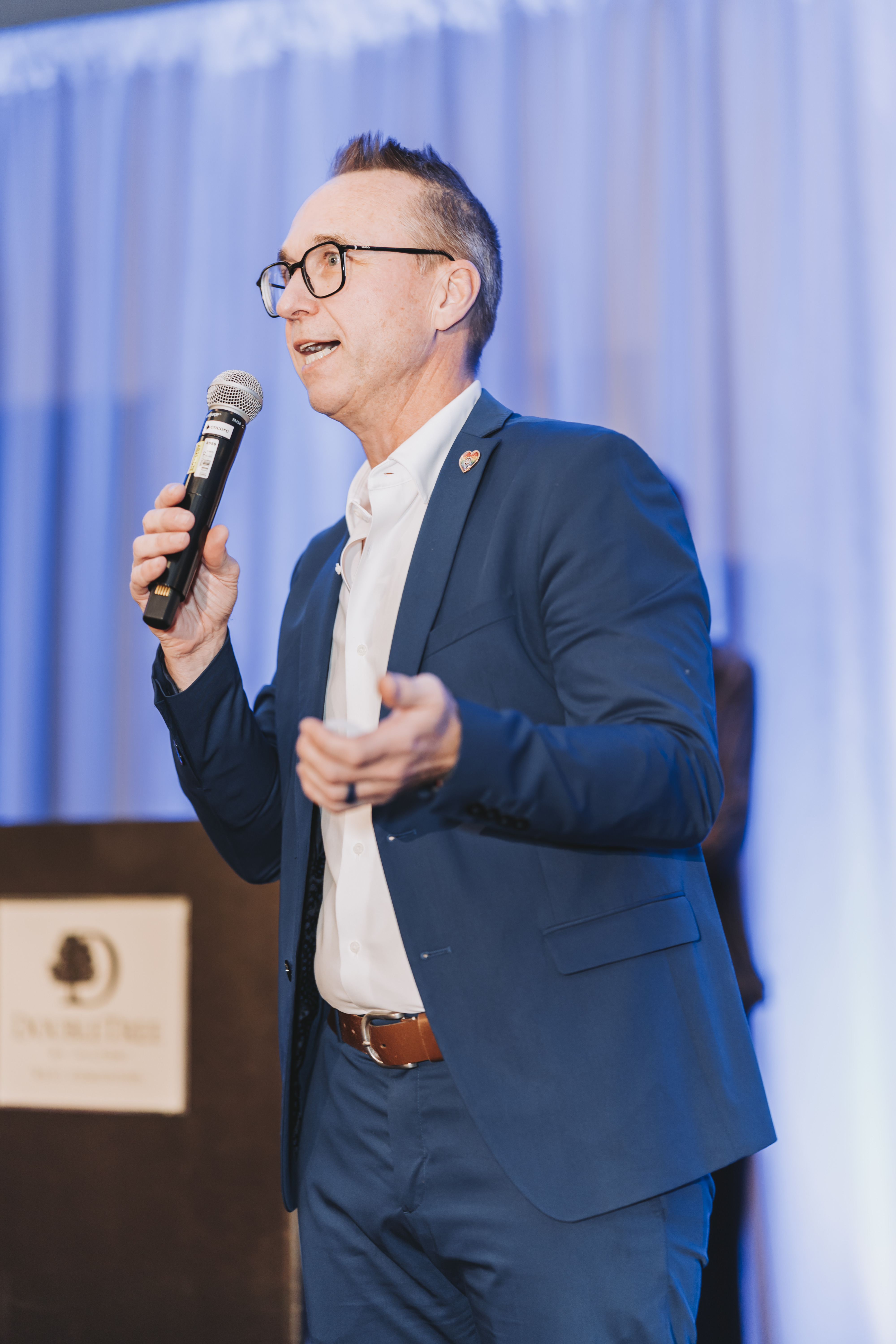 A guest speaking at the podium during the gala program
