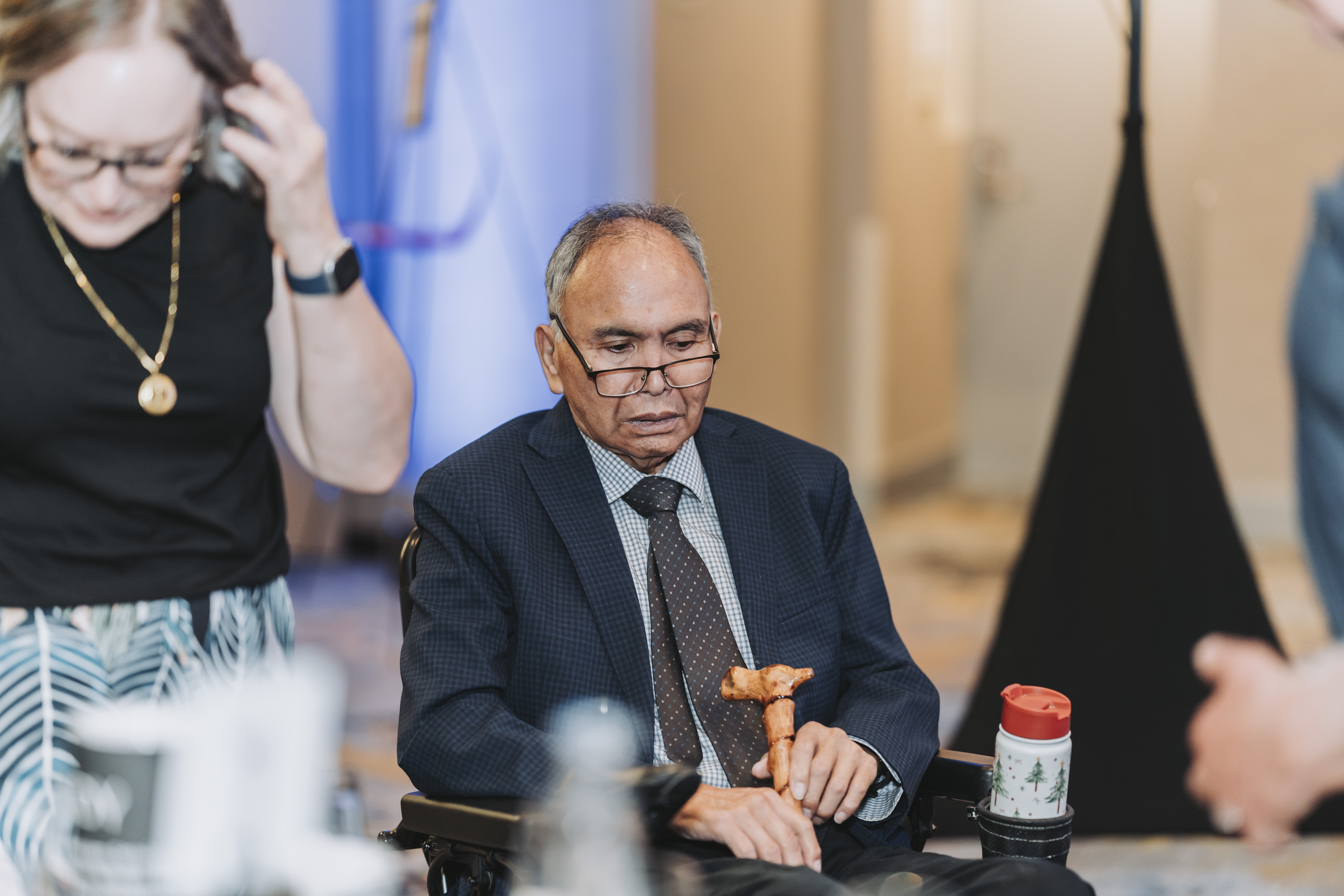 A guest seated in a wheelchair watching the gala program