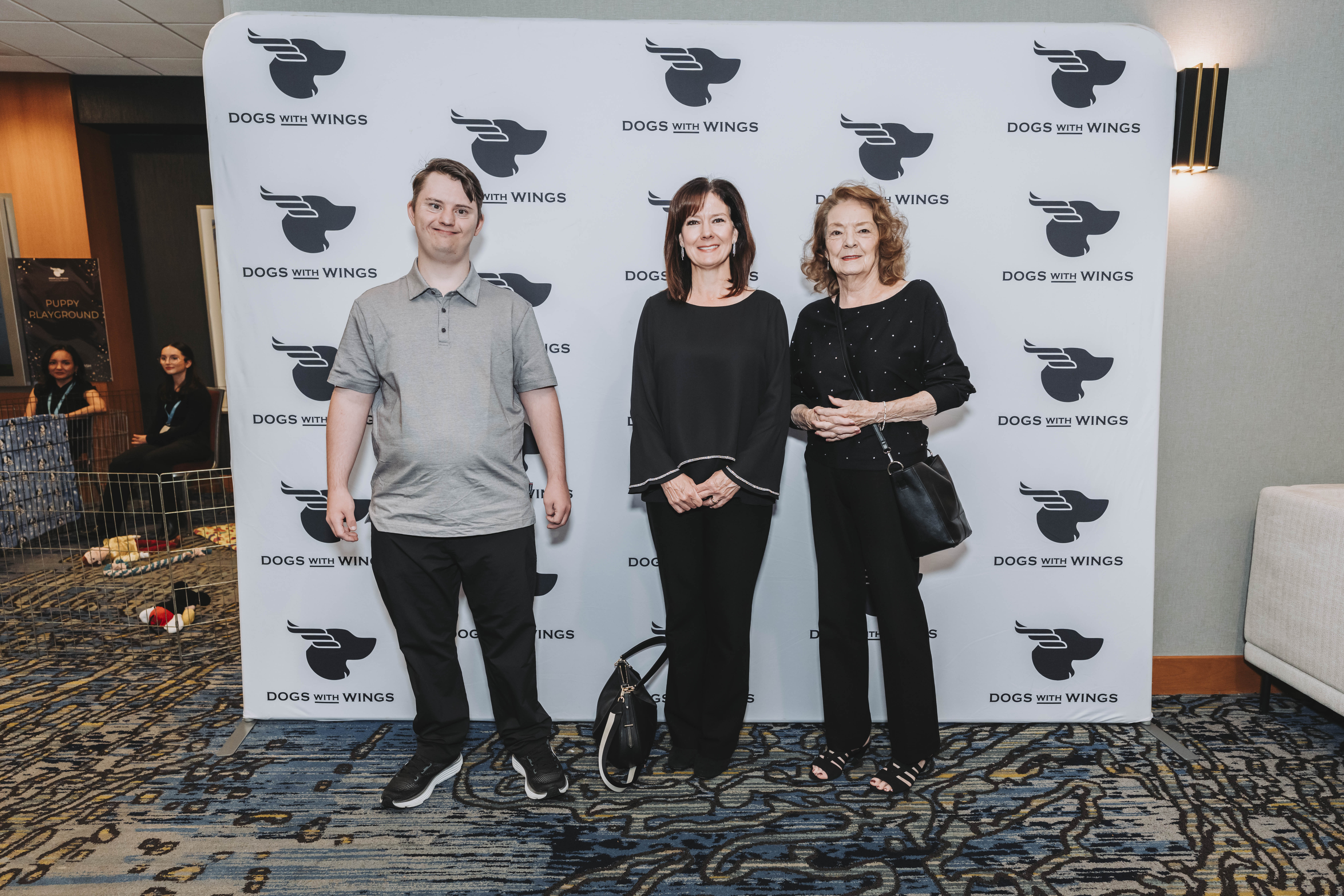Three guests together at the gala step-and-repeat