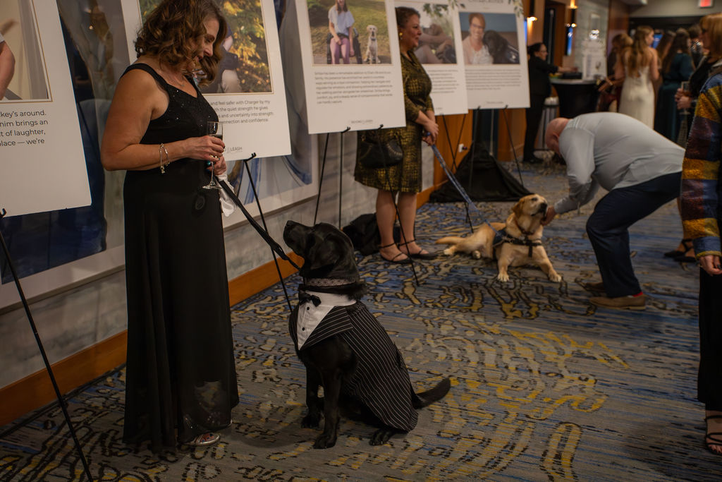 Dogs With Wings Gala attendees celebrating the community