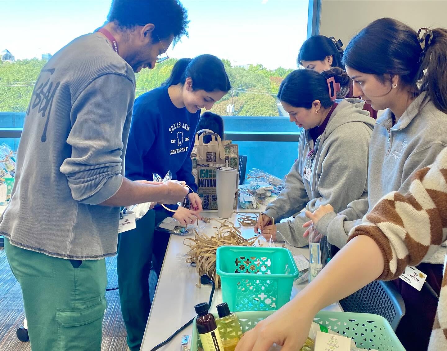 Volunteers assembling FACE bags with donated products