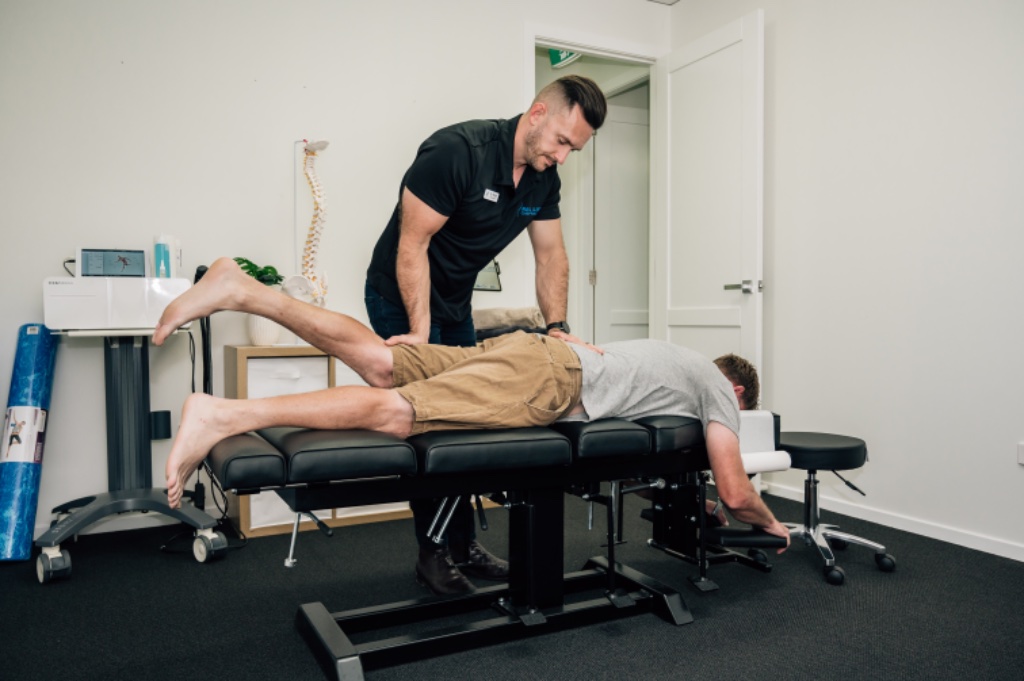 Chiropractor performing a spinal adjustment on a patient at Real Life Chiropractic Cessnock, NSW