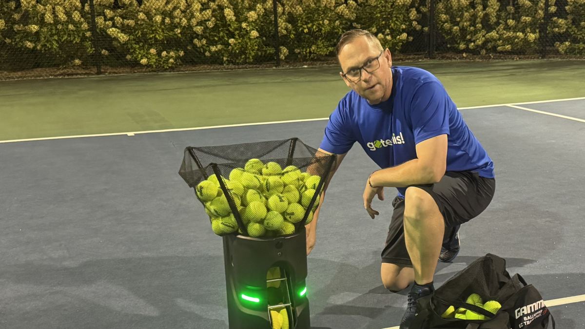 Shaun Boyce, ARA CEO, on court with the Tennibot Partner Lite
