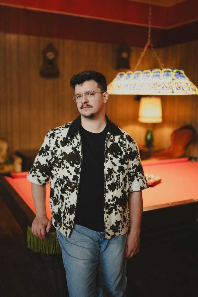Vince Kelly standing by a pool table