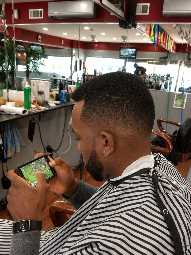 Man on phone in barbershop