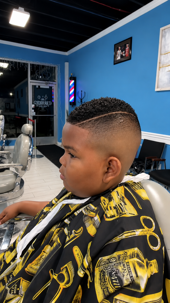 Young boy in warrior barber cape