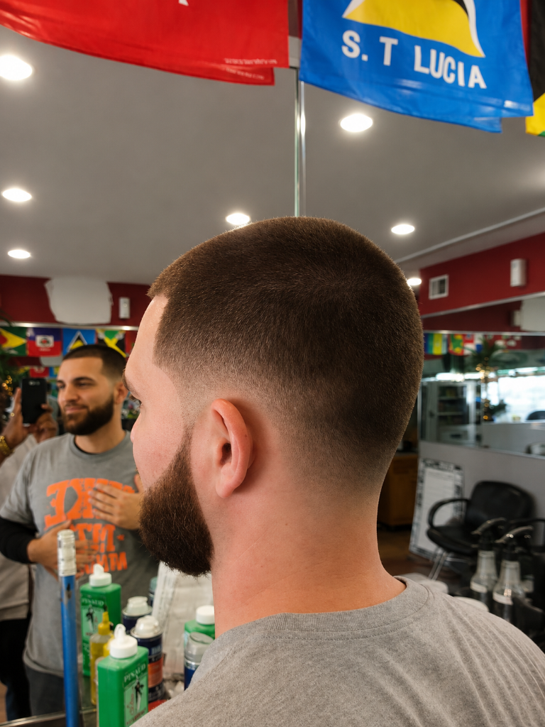 Man with fresh haircut and St. Lucia flag