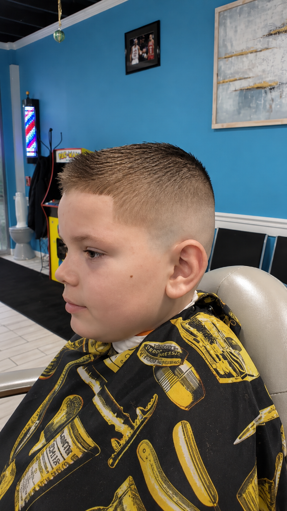 Young boy with fresh fade haircut