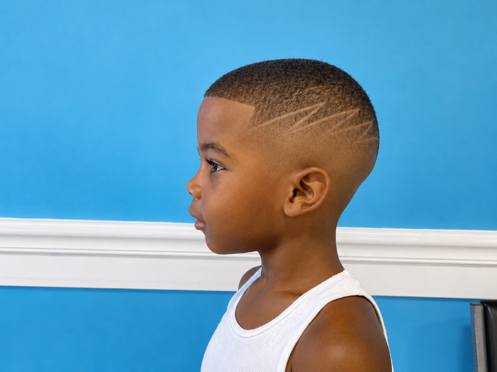 Young boy with zigzag hair design