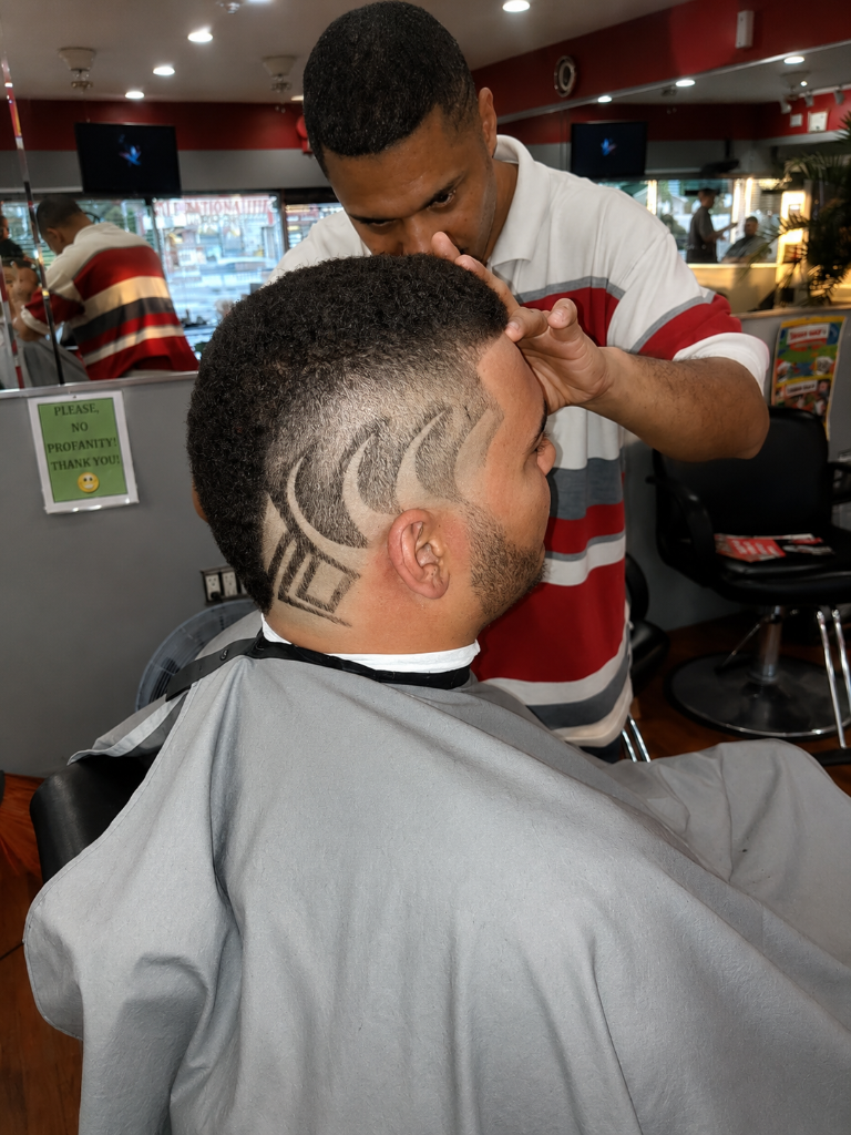 Intricate hair design cut into fade