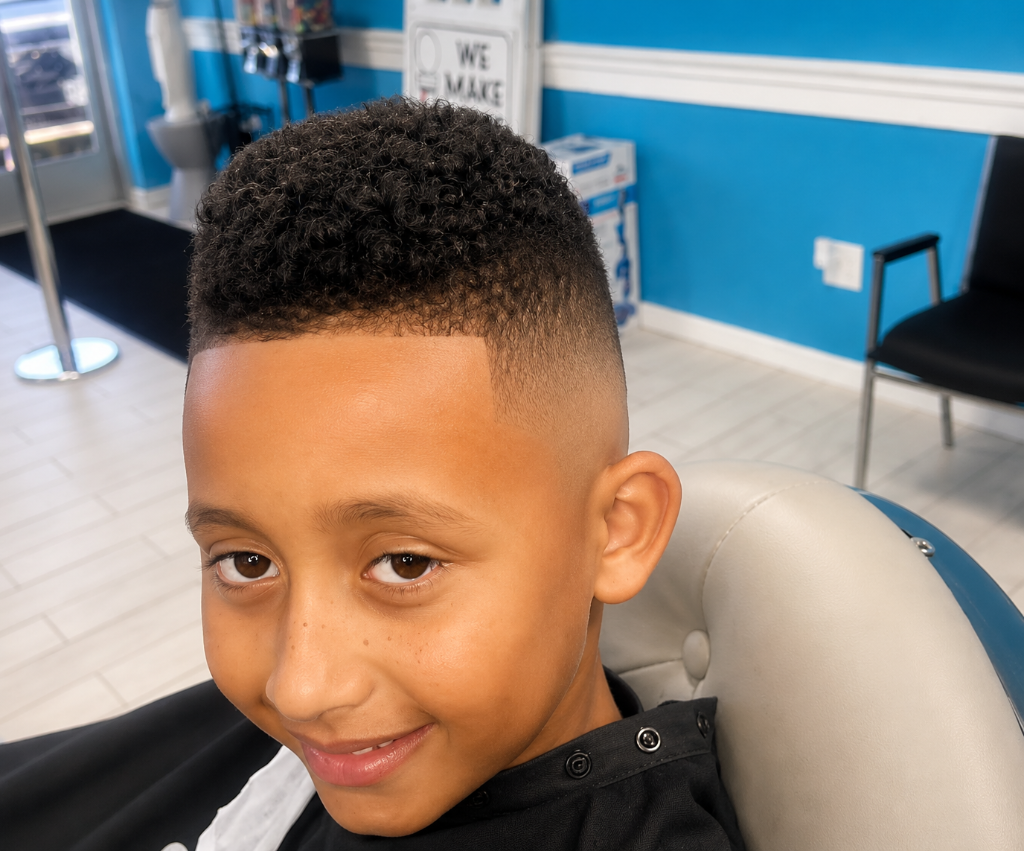 Boy with curly top and skin fade