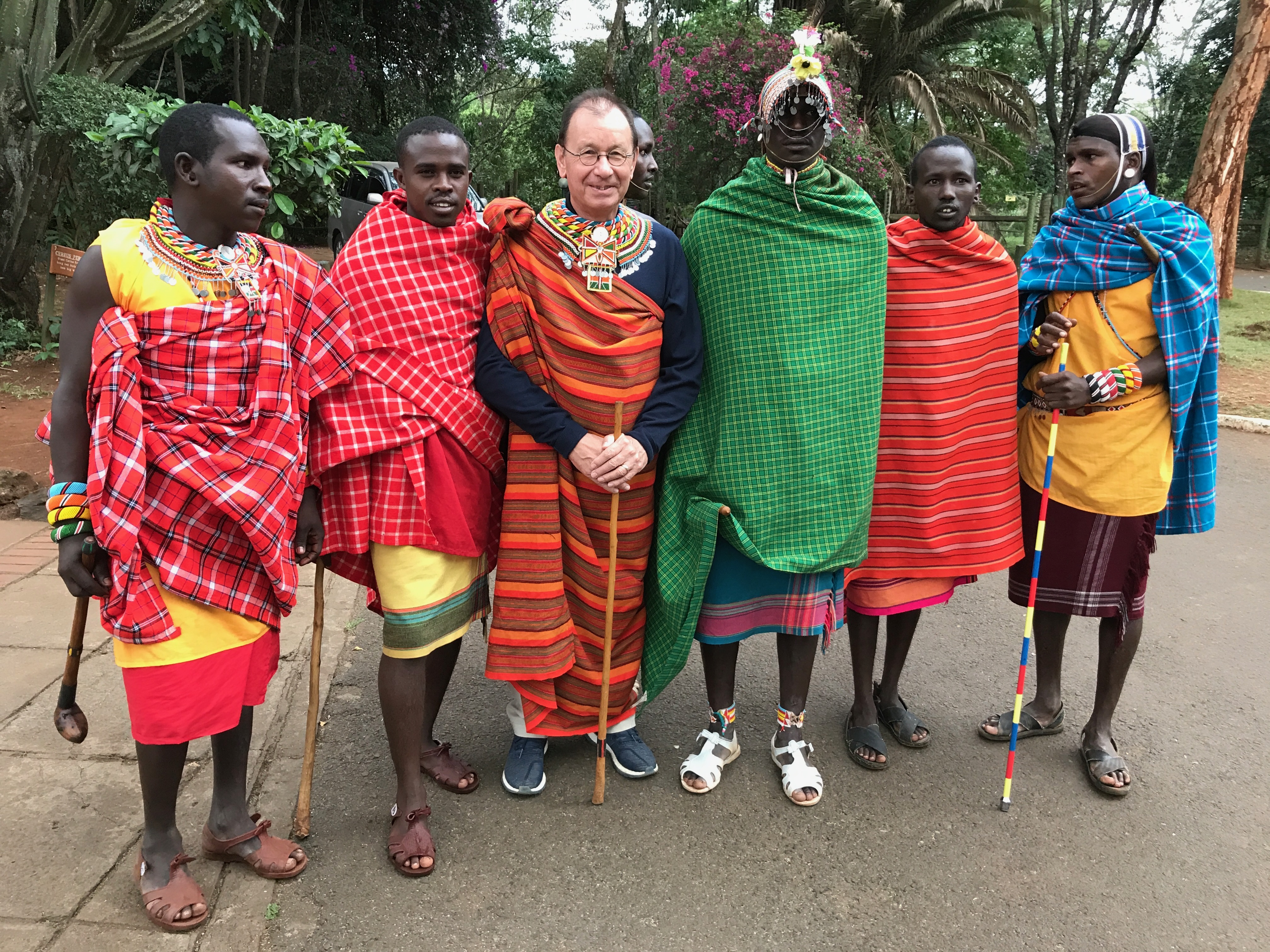 Paul Penfold with Maasai community members in traditional attire