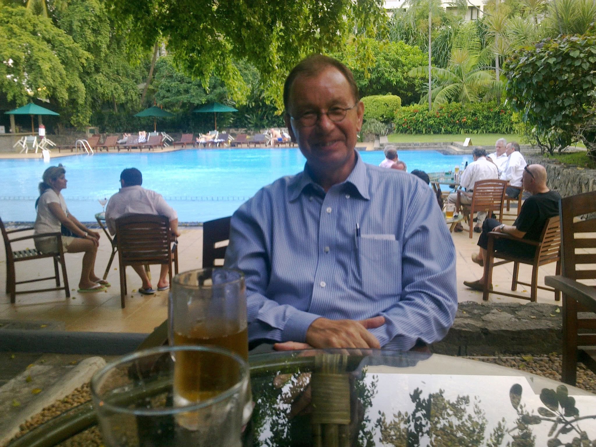 Paul Penfold relaxing at a hotel poolside in Sri Lanka during consultancy years