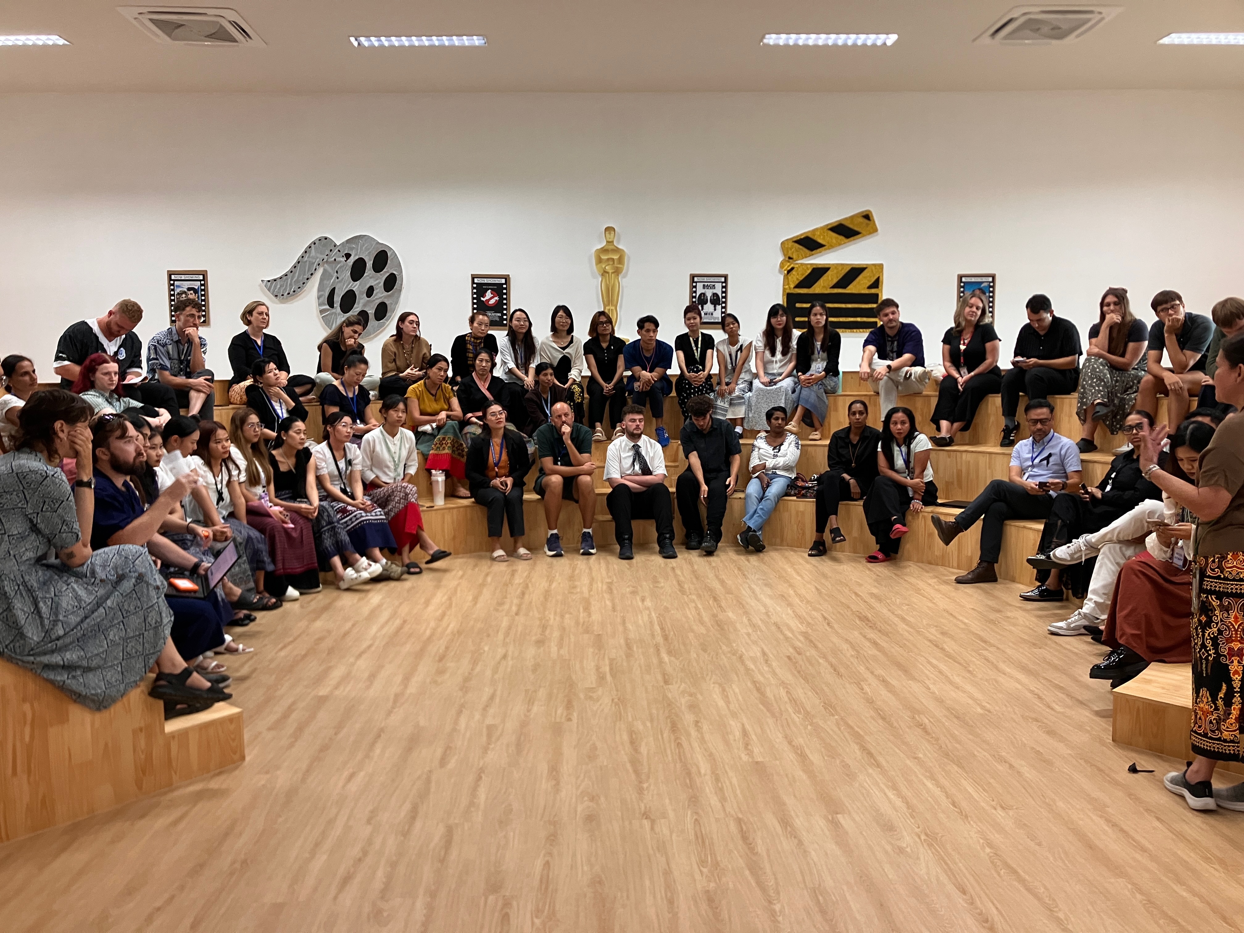 Workshop participants seated in an auditorium
