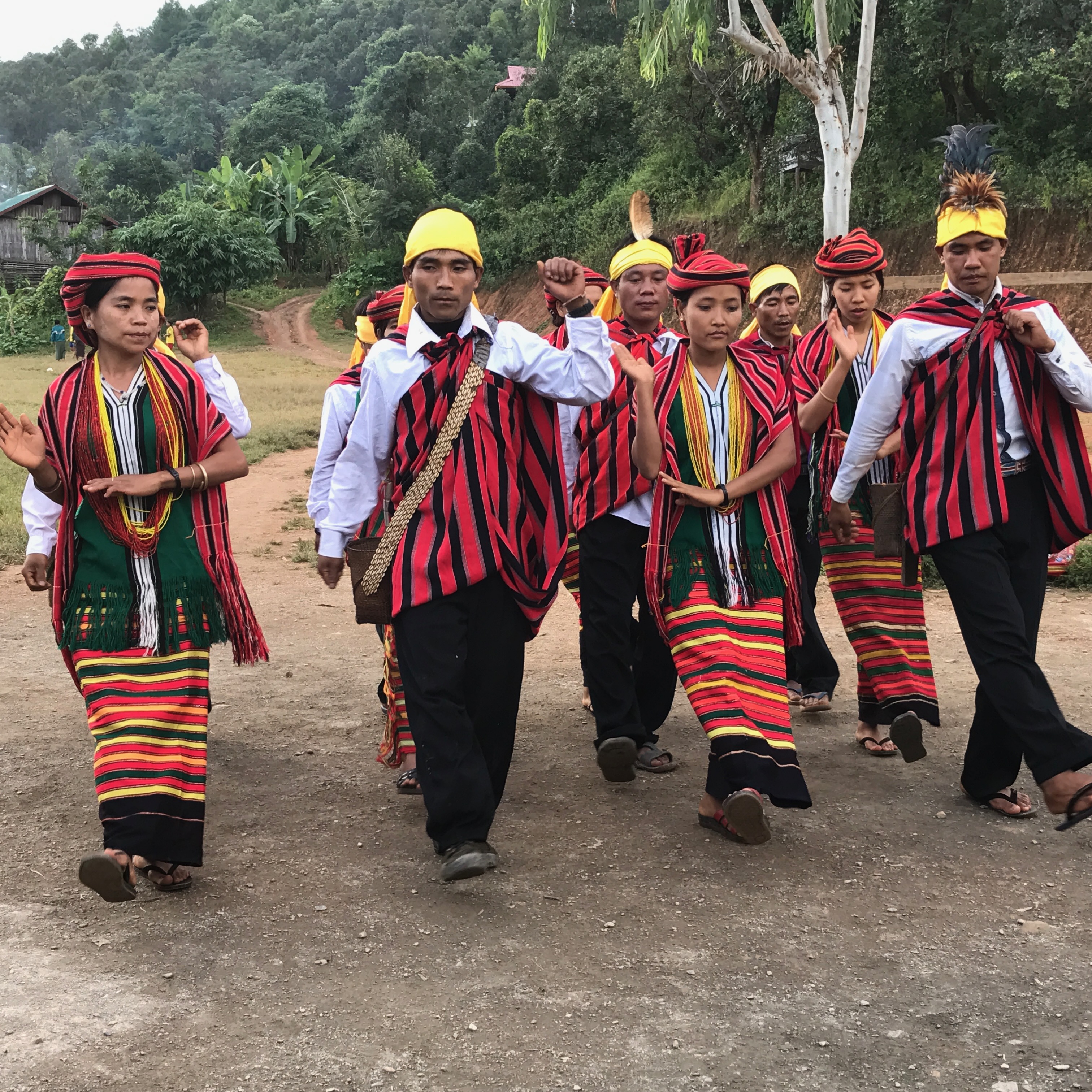 Myanmar cultural procession in traditional longyi attire