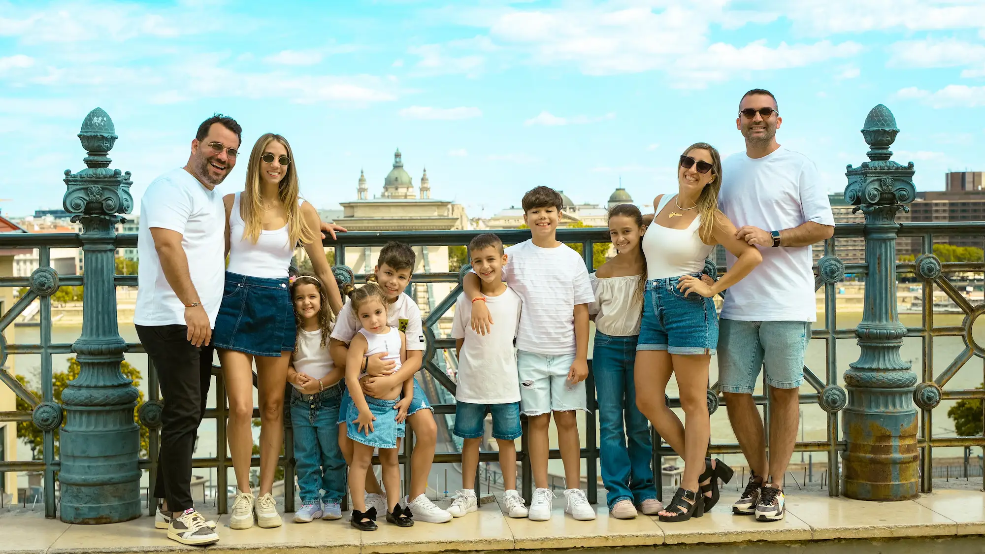 Family trip Budapest — large family group on Chain Bridge terrace