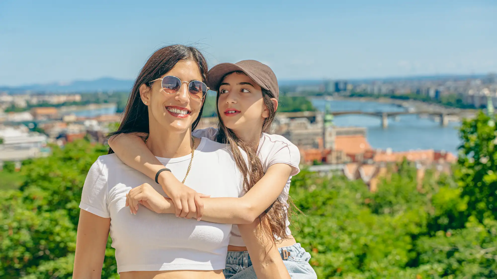 Professional photographer Budapest — mother and daughter with Danube river view