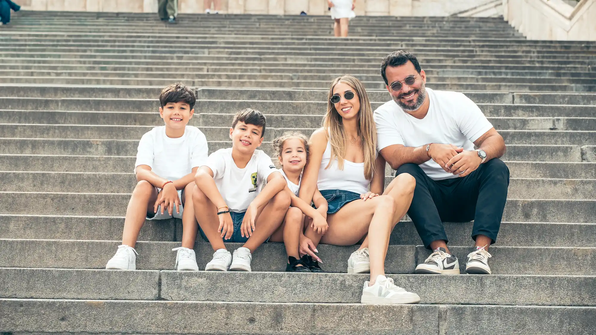 Professional photographer Budapest — family sitting on steps